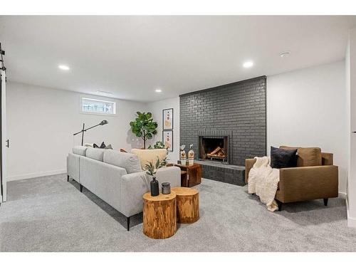 146 Winston Drive Sw, Calgary, AB - Indoor Photo Showing Basement With Fireplace