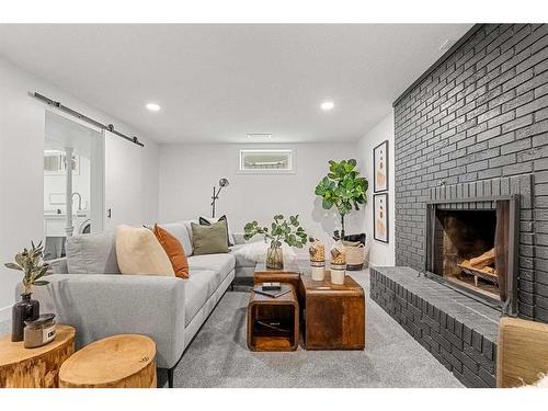 146 Winston Drive Sw, Calgary, AB - Indoor Photo Showing Living Room With Fireplace