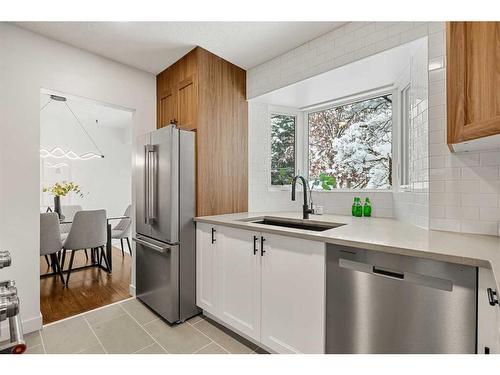 146 Winston Drive Sw, Calgary, AB - Indoor Photo Showing Kitchen With Stainless Steel Kitchen