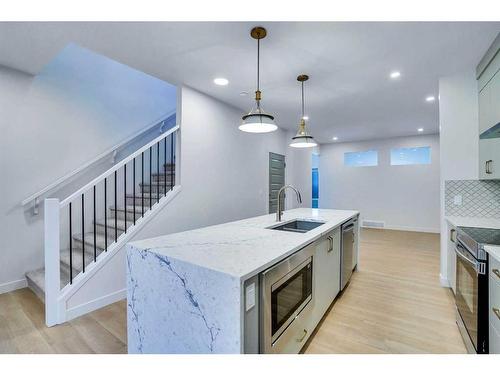 195 Lewiston Drive Ne, Calgary, AB - Indoor Photo Showing Kitchen With Double Sink