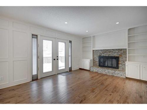 56 Deercrest Way Se, Calgary, AB - Indoor Photo Showing Living Room With Fireplace