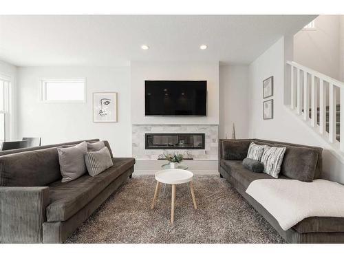 154 Cranbrook Cove, Calgary, AB - Indoor Photo Showing Living Room With Fireplace