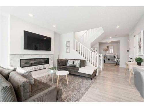 154 Cranbrook Cove, Calgary, AB - Indoor Photo Showing Living Room With Fireplace