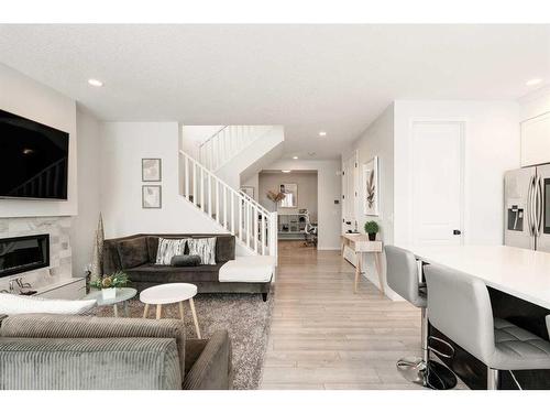 154 Cranbrook Cove, Calgary, AB - Indoor Photo Showing Living Room With Fireplace