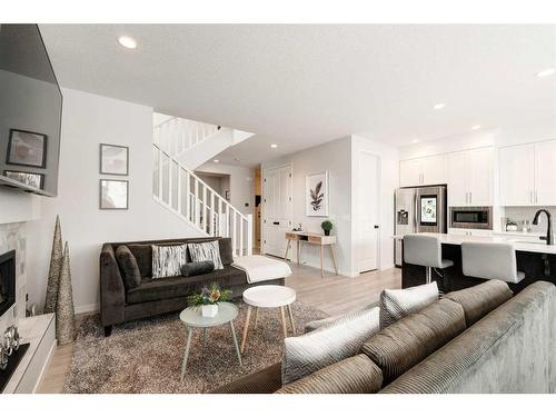 154 Cranbrook Cove, Calgary, AB - Indoor Photo Showing Living Room With Fireplace