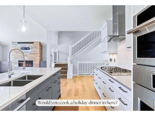 494 Stewart Creek Close, Canmore, AB - Indoor Photo Showing Kitchen With Double Sink With Upgraded Kitchen