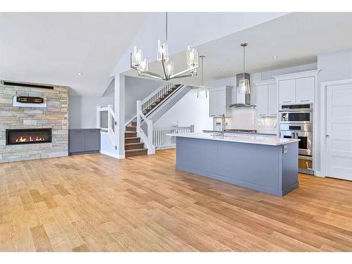 494 Stewart Creek Close, Canmore, AB - Indoor Photo Showing Kitchen With Fireplace With Upgraded Kitchen