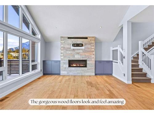 494 Stewart Creek Close, Canmore, AB - Indoor Photo Showing Living Room With Fireplace