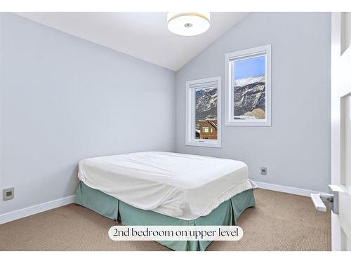 494 Stewart Creek Close, Canmore, AB - Indoor Photo Showing Bedroom