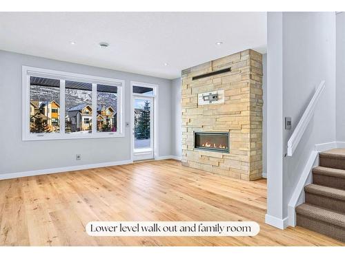 494 Stewart Creek Close, Canmore, AB - Indoor Photo Showing Living Room With Fireplace