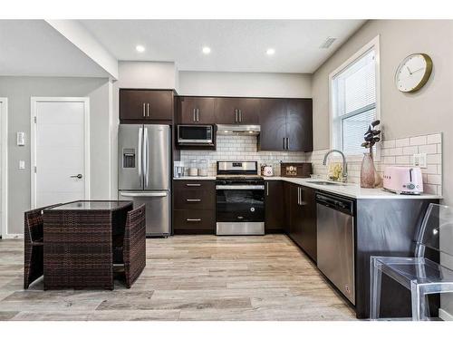 203-130 Redstone Walk Ne, Calgary, AB - Indoor Photo Showing Kitchen With Stainless Steel Kitchen With Upgraded Kitchen