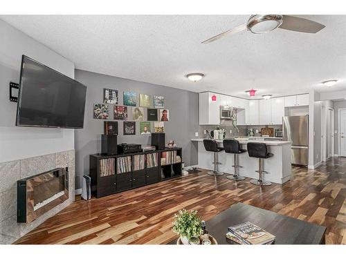 6-1032 1 Avenue Nw, Calgary, AB - Indoor With Fireplace