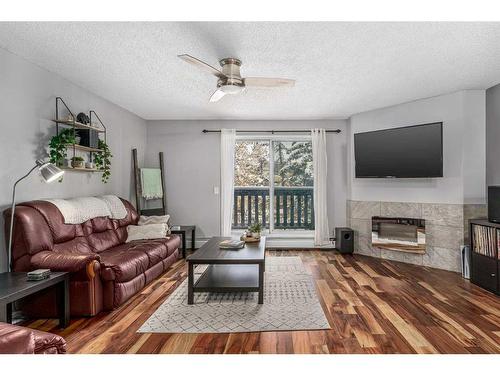 6-1032 1 Avenue Nw, Calgary, AB - Indoor Photo Showing Living Room With Fireplace