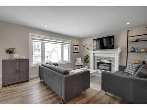 138 Riverglen Drive Se, Calgary, AB - Indoor Photo Showing Living Room With Fireplace