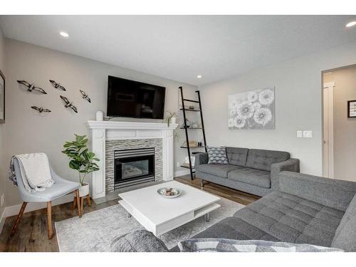 138 Riverglen Drive Se, Calgary, AB - Indoor Photo Showing Living Room With Fireplace