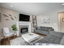 138 Riverglen Drive Se, Calgary, AB  - Indoor Photo Showing Living Room With Fireplace 