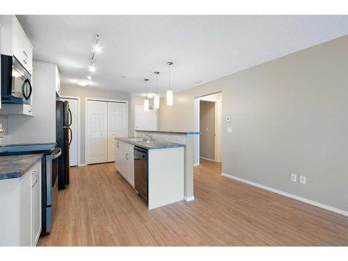 2106-700 Willowbrook Road Nw, Airdrie, AB - Indoor Photo Showing Kitchen With Upgraded Kitchen