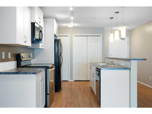 2106-700 Willowbrook Road Nw, Airdrie, AB - Indoor Photo Showing Kitchen