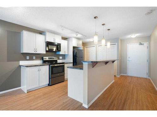 2106-700 Willowbrook Road Nw, Airdrie, AB - Indoor Photo Showing Kitchen