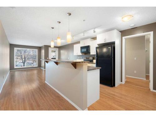 2106-700 Willowbrook Road Nw, Airdrie, AB - Indoor Photo Showing Kitchen