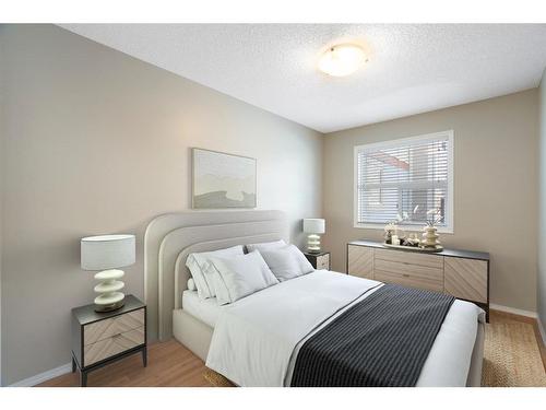 2106-700 Willowbrook Road Nw, Airdrie, AB - Indoor Photo Showing Bedroom