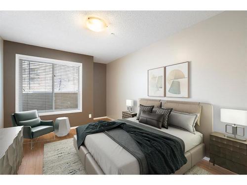 2106-700 Willowbrook Road Nw, Airdrie, AB - Indoor Photo Showing Bedroom