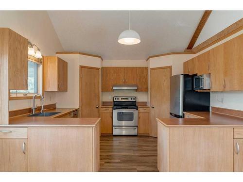 612 Main Street, Diamond Valley, AB - Indoor Photo Showing Kitchen With Stainless Steel Kitchen