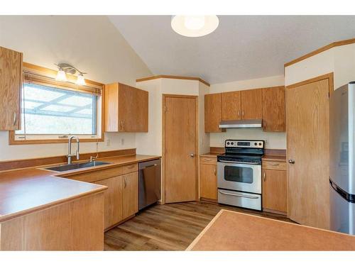 612 Main Street, Diamond Valley, AB - Indoor Photo Showing Kitchen With Stainless Steel Kitchen