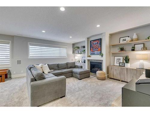 432 Discovery Ridge Bay Sw, Calgary, AB - Indoor Photo Showing Living Room With Fireplace