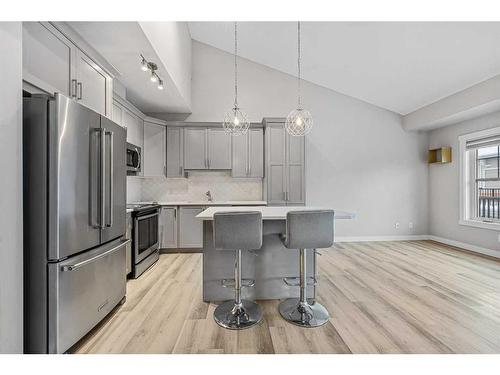 1005 Cranbrook Walk Se, Calgary, AB - Indoor Photo Showing Kitchen With Stainless Steel Kitchen With Upgraded Kitchen