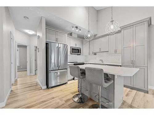 1005 Cranbrook Walk Se, Calgary, AB - Indoor Photo Showing Kitchen With Stainless Steel Kitchen With Upgraded Kitchen