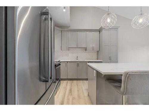 1005 Cranbrook Walk Se, Calgary, AB - Indoor Photo Showing Kitchen With Stainless Steel Kitchen With Upgraded Kitchen