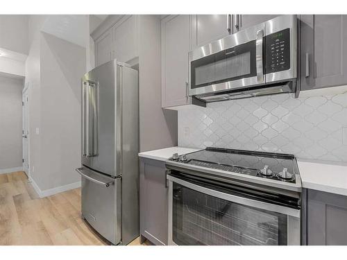 1005 Cranbrook Walk Se, Calgary, AB - Indoor Photo Showing Kitchen With Stainless Steel Kitchen