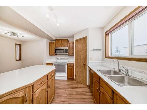 489 Country Hills Drive Nw, Calgary, AB - Indoor Photo Showing Kitchen With Double Sink