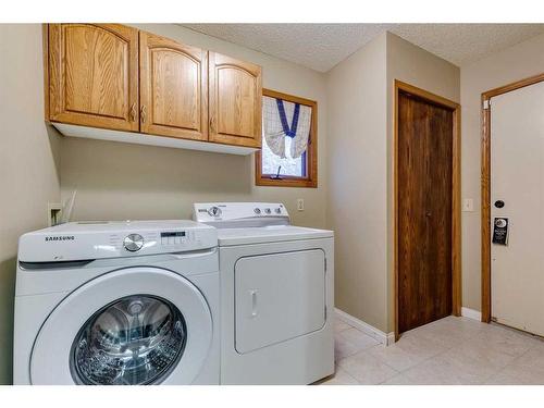 53 Shawnee Rise Sw, Calgary, AB - Indoor Photo Showing Laundry Room