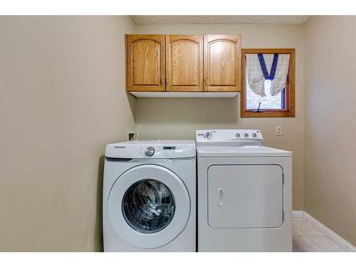 53 Shawnee Rise Sw, Calgary, AB - Indoor Photo Showing Laundry Room