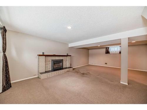 104 Brazeau Crescent Sw, Calgary, AB - Indoor With Fireplace