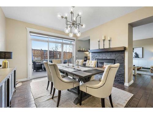 110 Ascot Crescent Sw, Calgary, AB - Indoor Photo Showing Dining Room With Fireplace