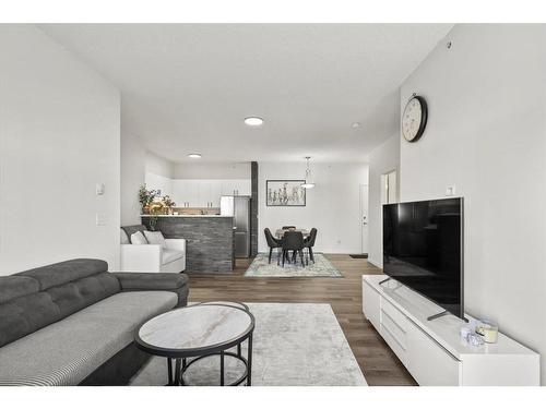 1415-1140 Taradale Drive Ne, Calgary, AB - Indoor Photo Showing Living Room