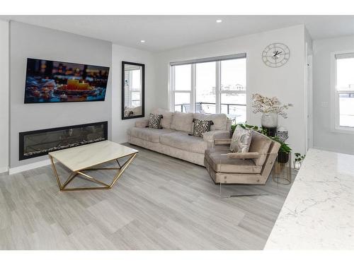 32 Cornerbrook Cove Ne, Calgary, AB - Indoor Photo Showing Living Room With Fireplace