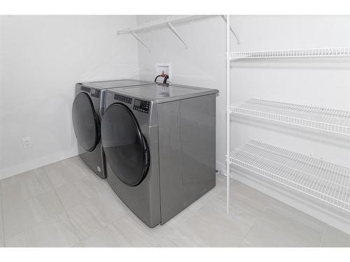 32 Cornerbrook Cove Ne, Calgary, AB - Indoor Photo Showing Laundry Room