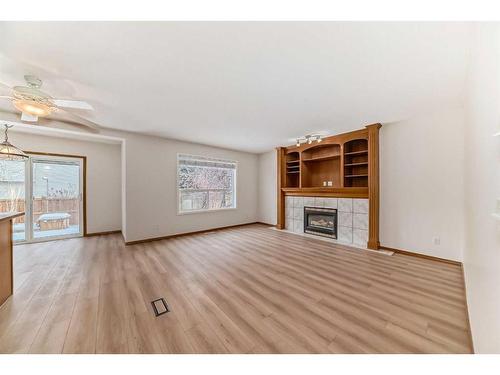 221 Mt Douglas Circle Se, Calgary, AB - Indoor Photo Showing Living Room With Fireplace