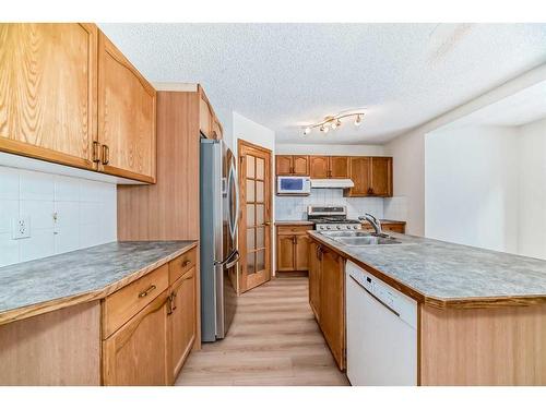 221 Mt Douglas Circle Se, Calgary, AB - Indoor Photo Showing Kitchen With Double Sink