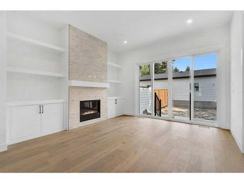 4626 20 Avenue Nw, Calgary, AB - Indoor Photo Showing Other Room With Fireplace