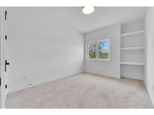 4626 20 Avenue Nw, Calgary, AB - Indoor Photo Showing Living Room With Fireplace