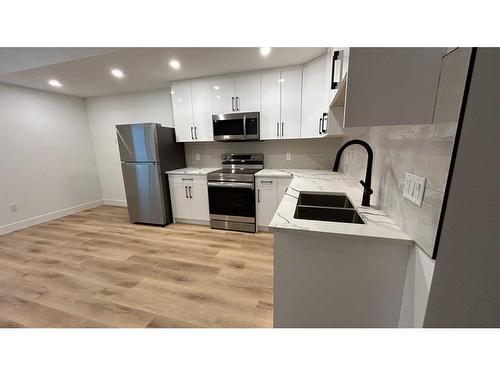 4626 20 Avenue Nw, Calgary, AB - Indoor Photo Showing Kitchen With Double Sink