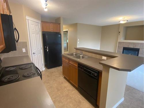 376 Silverado Drive Sw, Calgary, AB - Indoor Photo Showing Kitchen With Double Sink