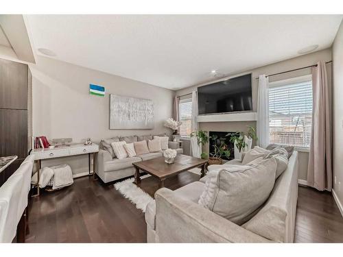 2034 New Brighton Park Se, Calgary, AB - Indoor Photo Showing Living Room With Fireplace