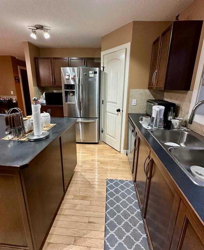 234 Saddlebrook Way Ne, Calgary, AB - Indoor Photo Showing Kitchen With Double Sink