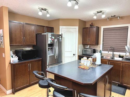 234 Saddlebrook Way Ne, Calgary, AB - Indoor Photo Showing Kitchen With Double Sink